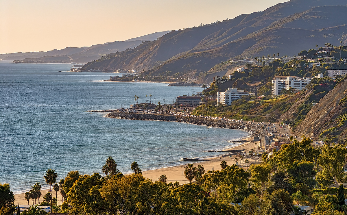 View of California coast and beach with mountains background