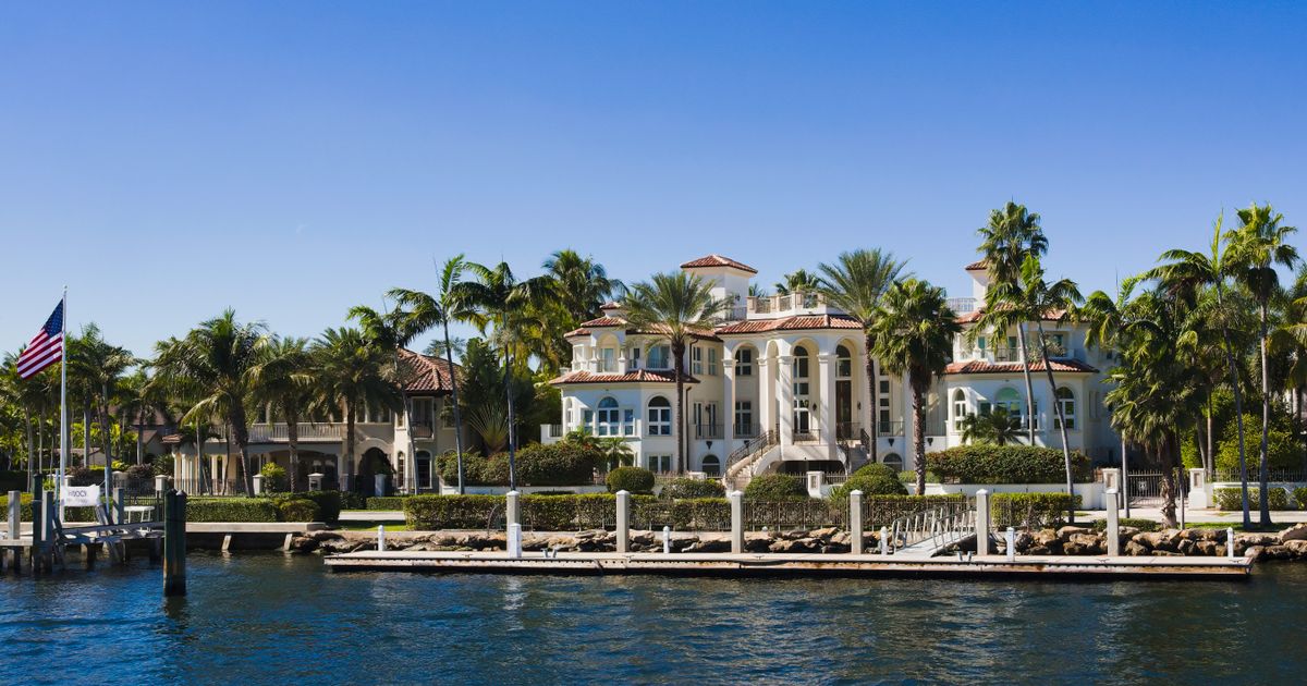 A South Florida home under a clear blue sky, representing residential property value in Palm Beach County