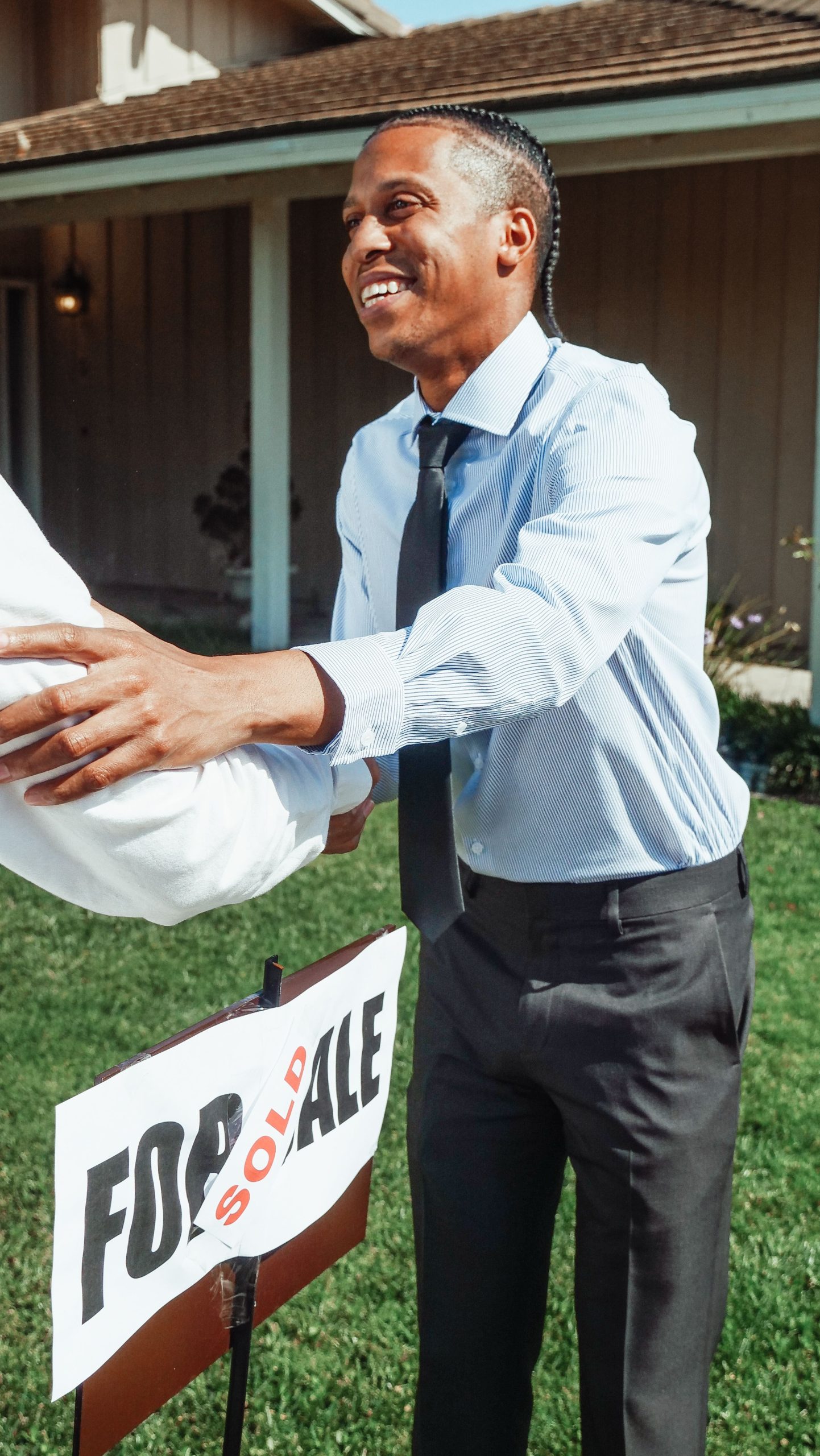 Home seller shaking hands after accepting a cash offer on a Palm Beach County property