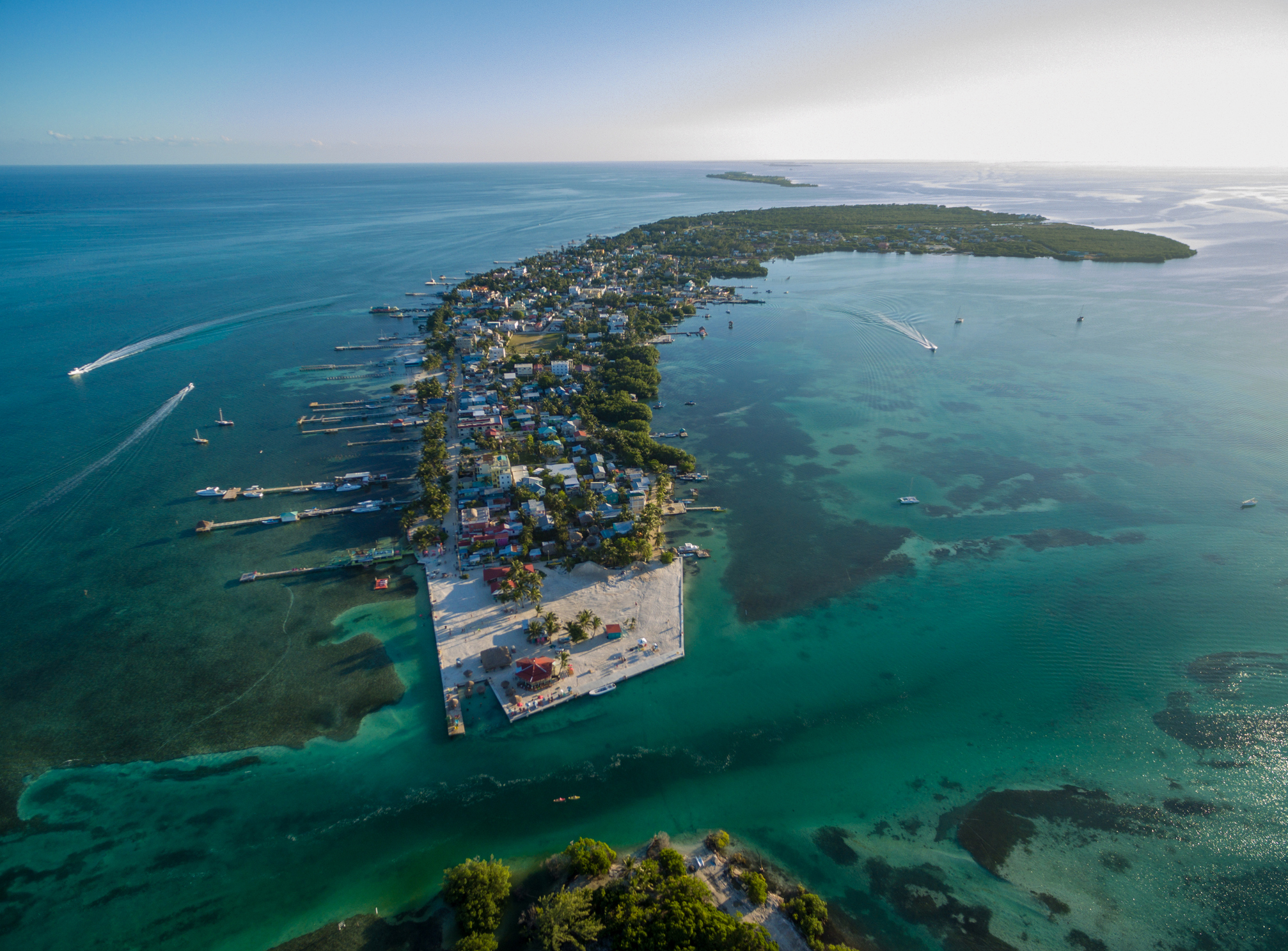 Caye Caulker island in Belize. Cloudy Morning Sky and Caribbean Sea in Background.