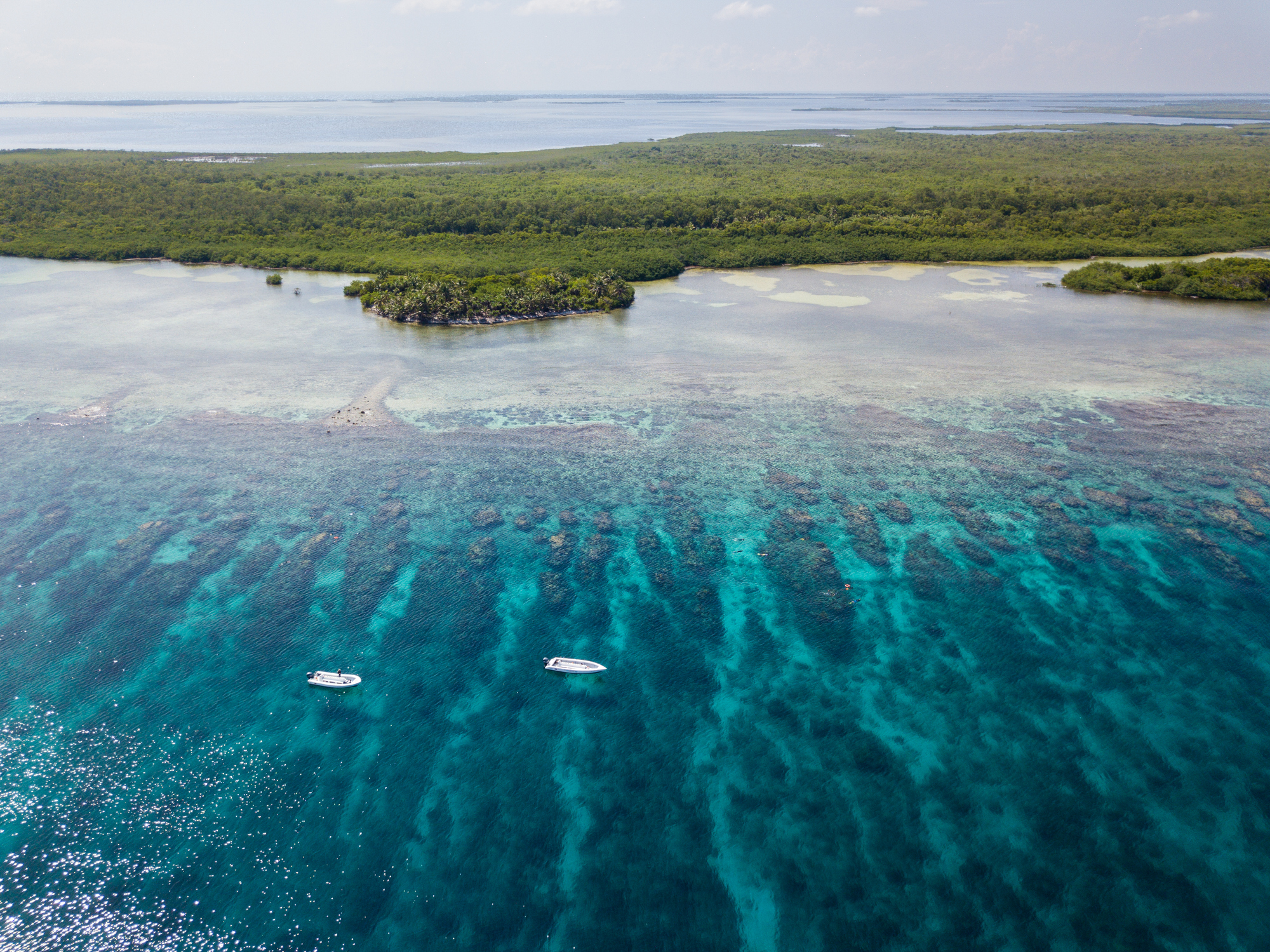 Boats Floating Above Caribbean Coral Reef