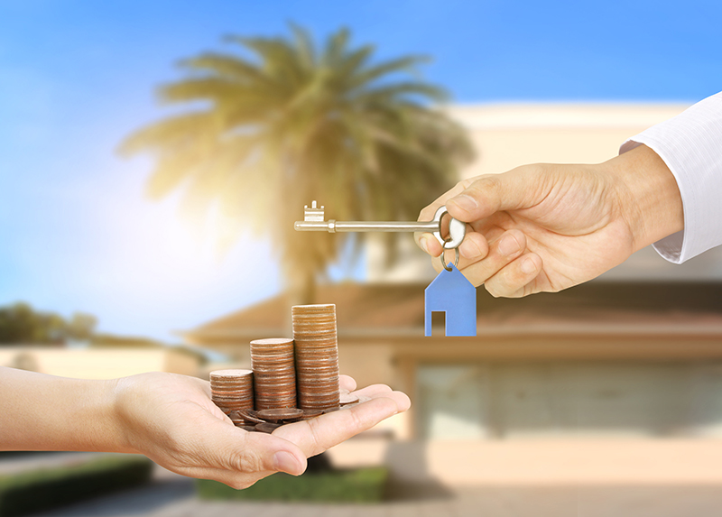 Investment concept ,House key in hand