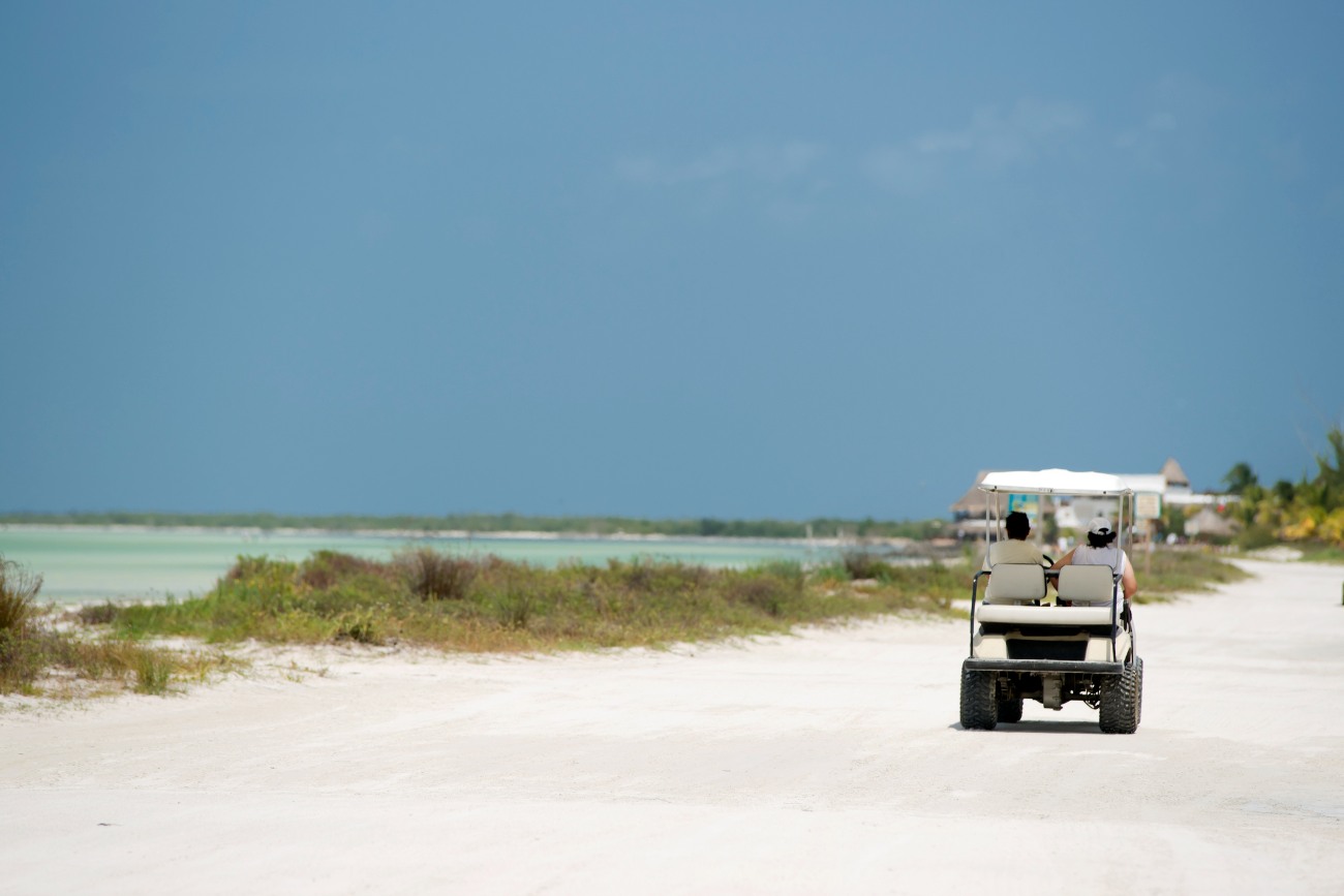 Golf Cart Driving on a Caribbean Beach