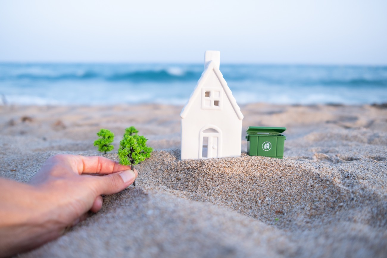 Planting trees near miniature house