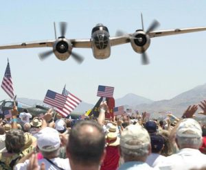 Airplane dropping flowers Memorial Day Flower Drop