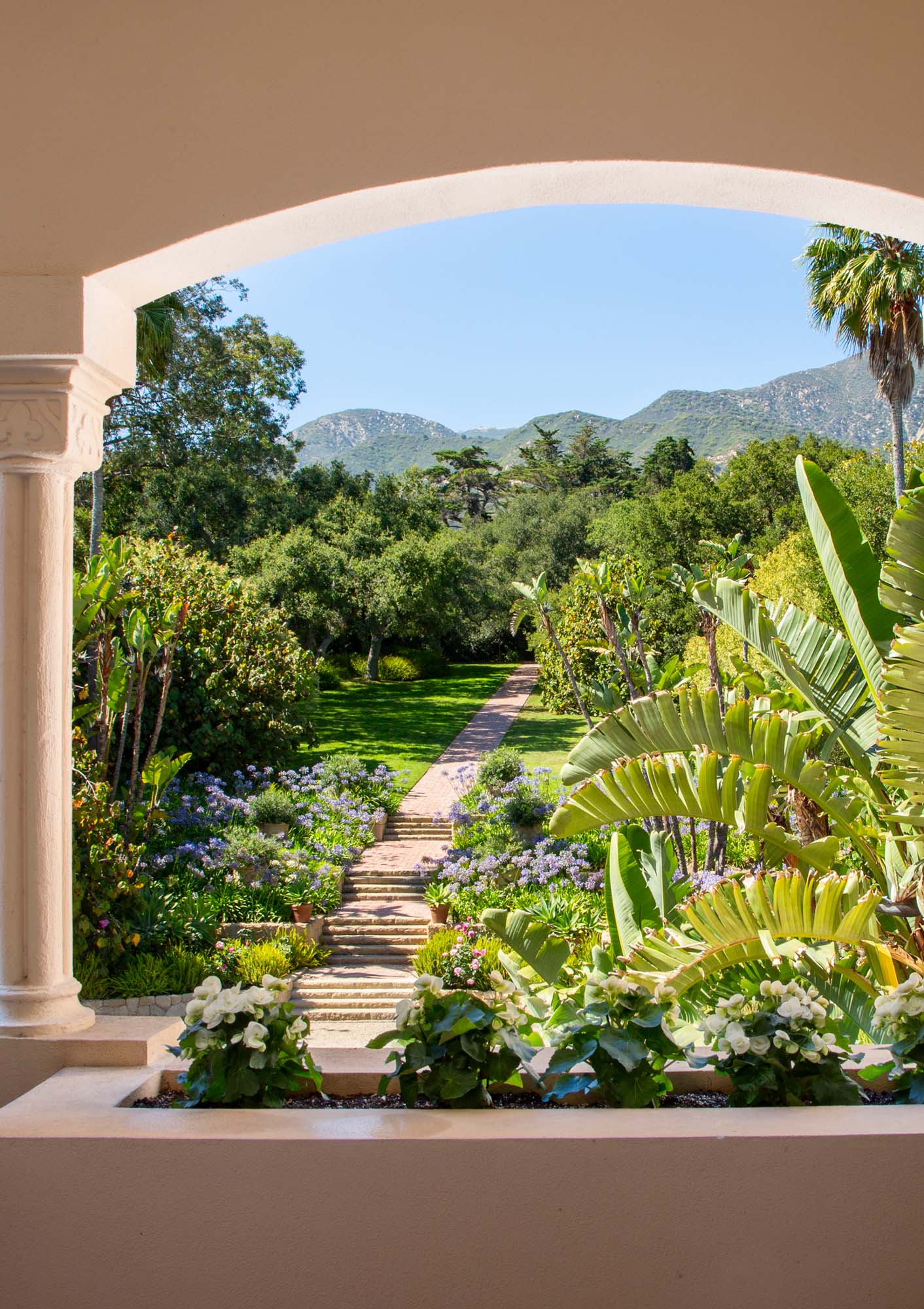 Views of lush gardens and hills abound.