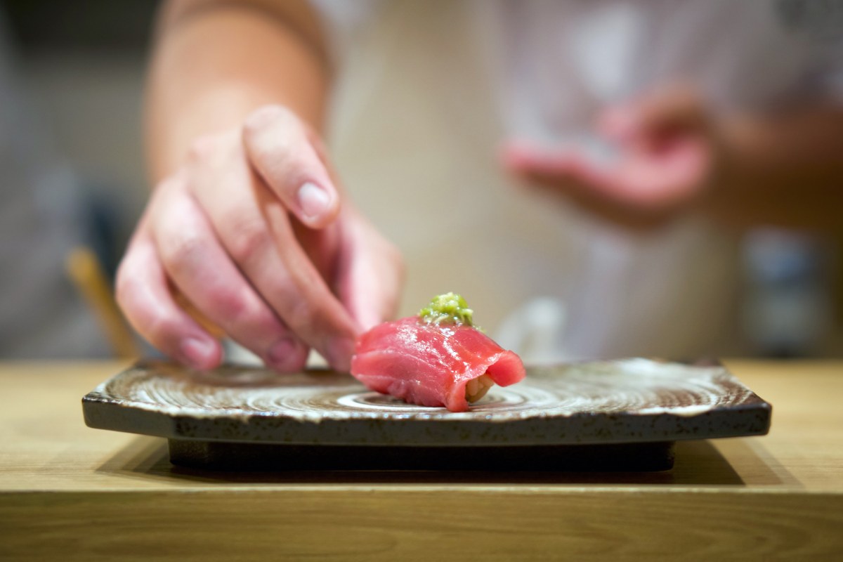 Tuna Sushi with fresh wasabi served on ceramic plate. Enjoy Omakase experience at Japanese Sushi Restaurant