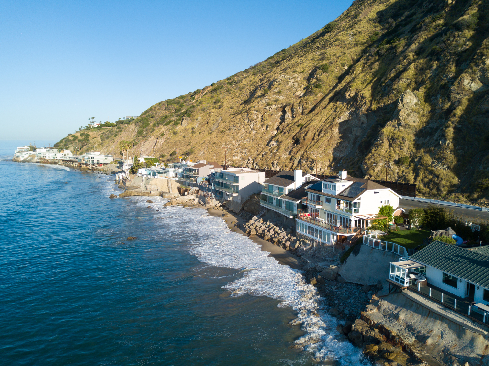 An aerial shot of Malibu oceanfront estates, a great alternative to Beverly Hills luxury real estate.