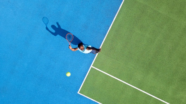 Tennis player on a blue court