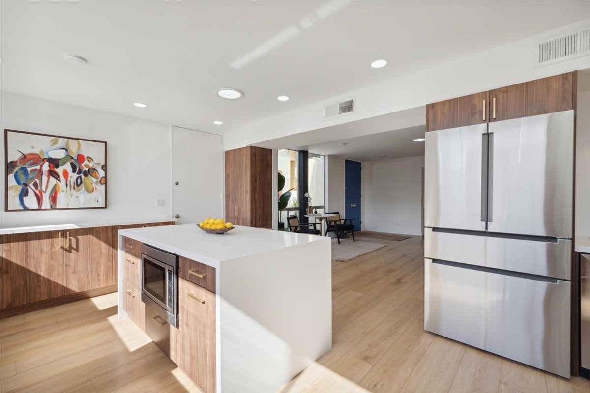A designer kitchen featuring light, natural colors.