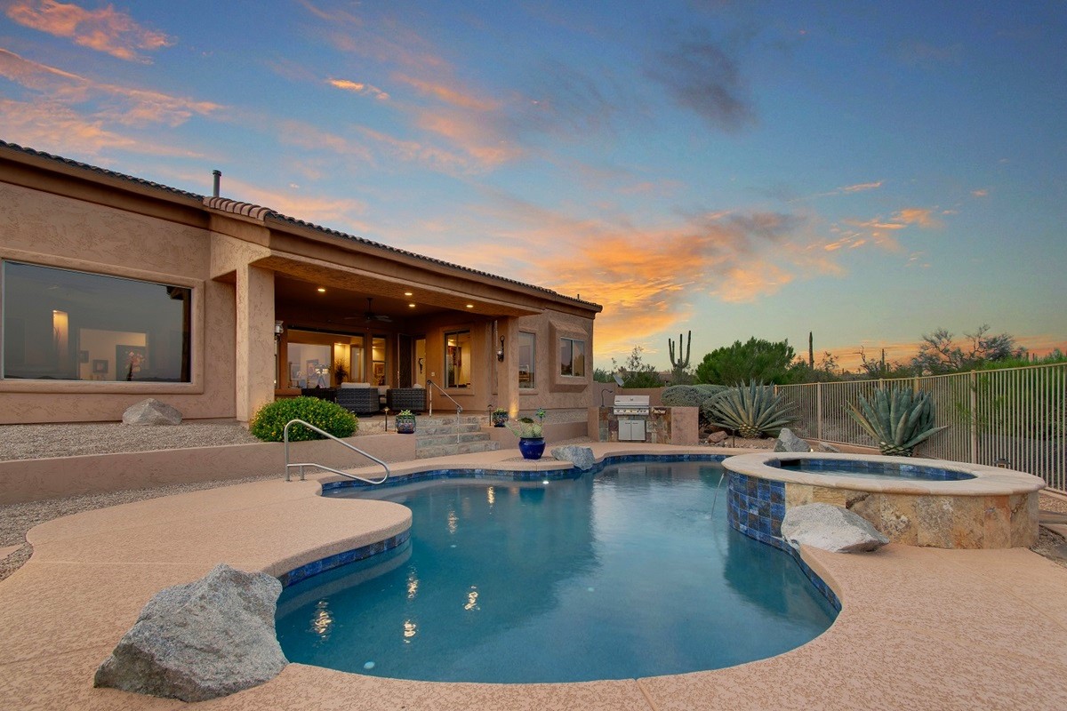 Backyard pool at sunset.