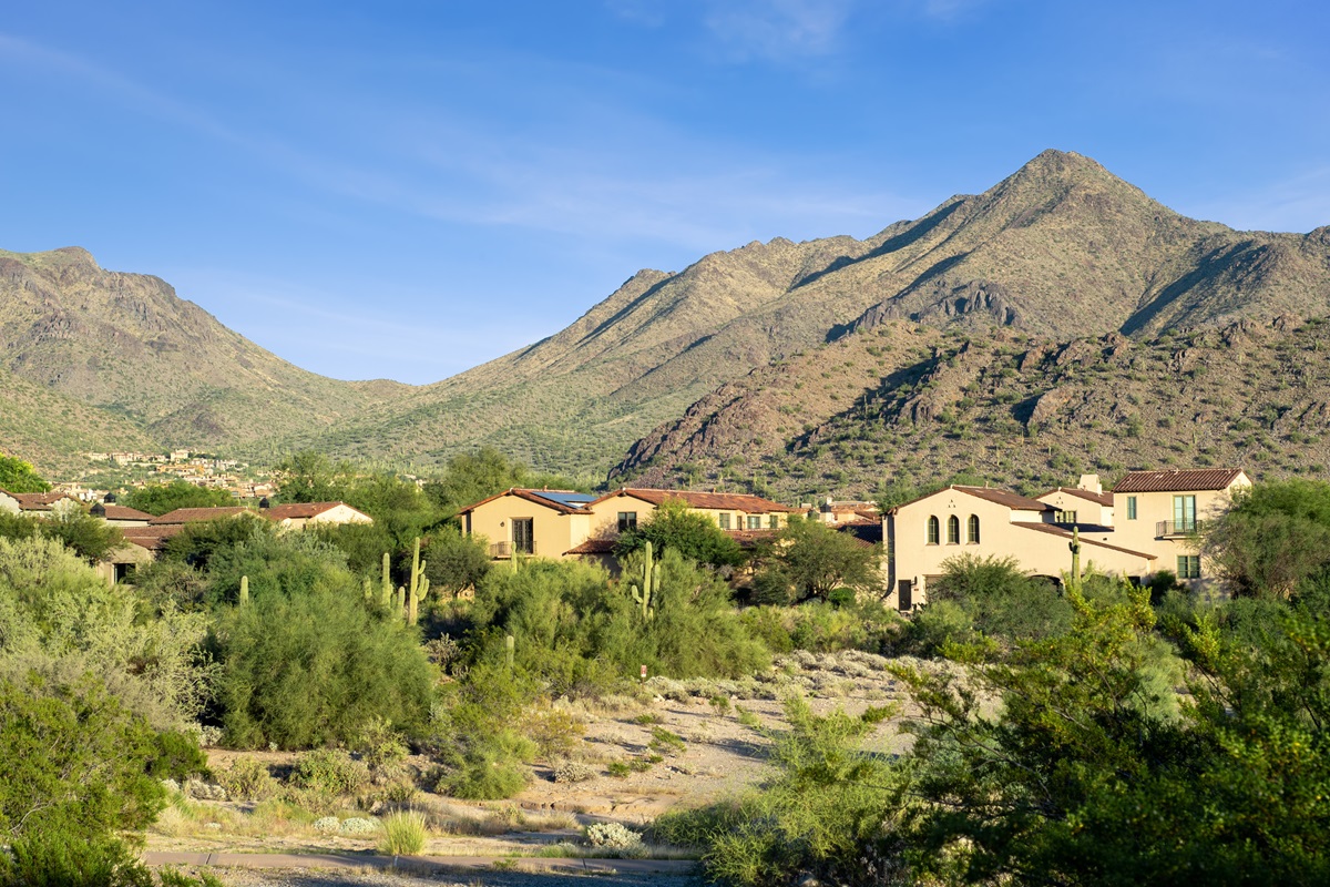 Luxury homes in front of a mountain in North Scottsdale's community of DC Ranch.