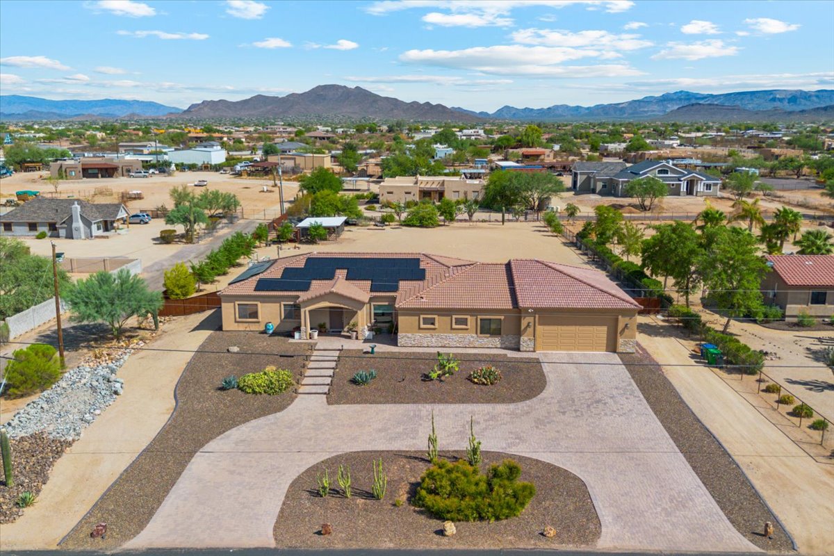 A home in Desert Hills on an acre of land seen from high above drone shot.