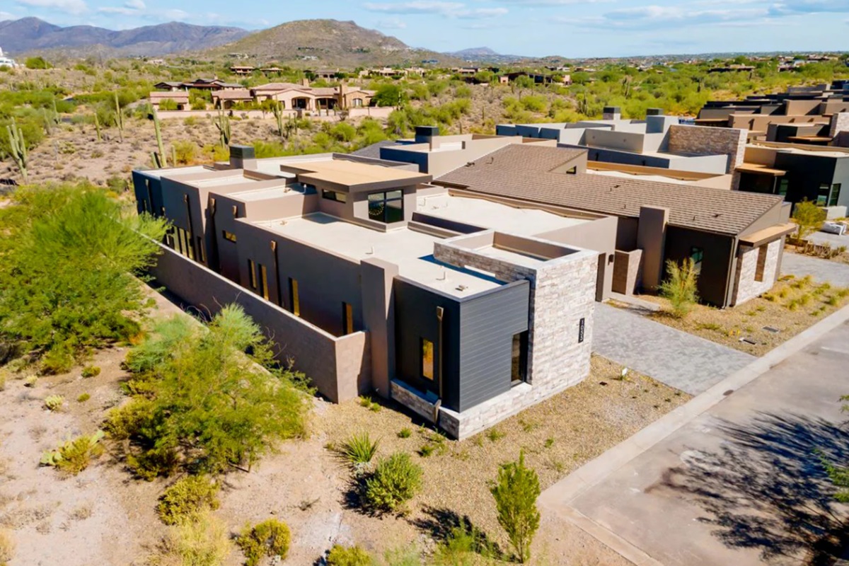 Modern home in Desert Mountain with desert landscape and mountain views.