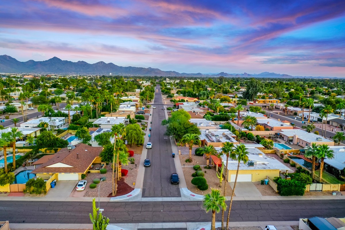 Shows a residential neighborhood with the mountain views, perfectly capturing the layout and suburban charm of Scottsdale.