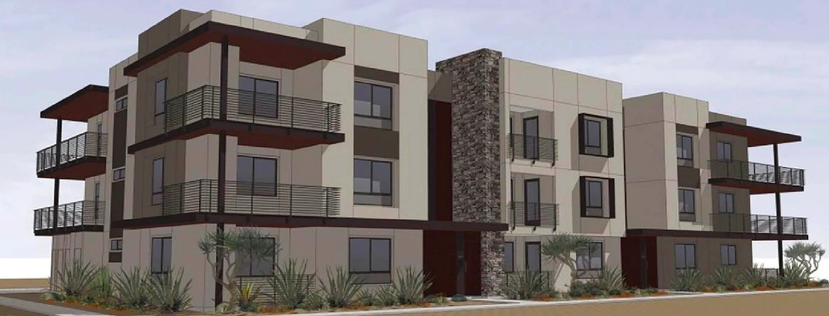 Rendering of Legacy North development showing a modern three-story building with balconies, large windows, and desert landscaping.