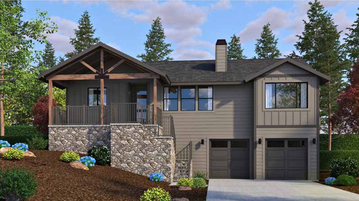 A two-story home with a stone foundation, elevated porch, and dark siding, nestled within a forested area in The Highlands at Tovar Springs.