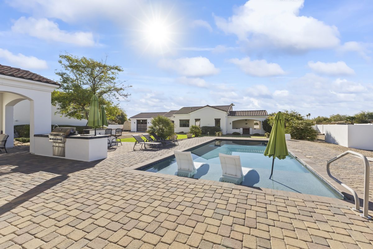 The backyard pool and backside of a custom luxury home in Scottsdale, Arizona's Cactus Corridor.