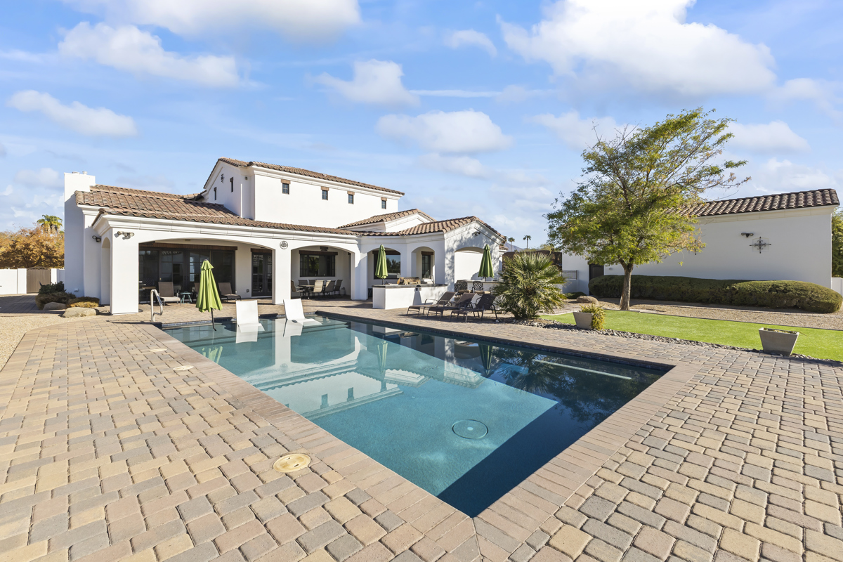 The backyard pool and backside of a custom luxury home in Scottsdale, Arizona's Cactus Corridor.