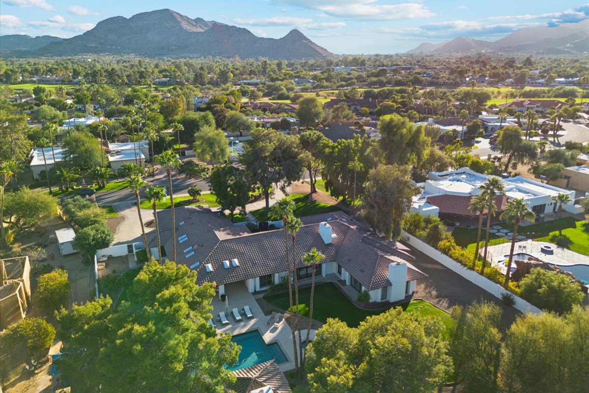 Top down view of luxury home in Paradise Valley with Camelback Mountain in the background.