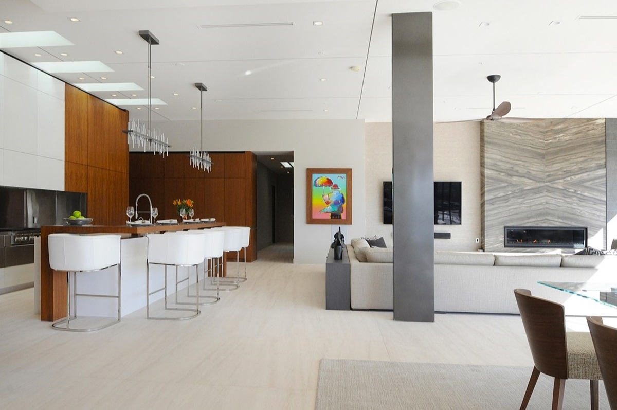 Spacious Scottsdale rental property with sleek open-concept living area, modern kitchen, and stylish bar seating.