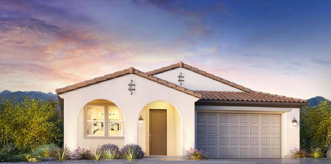 Spanish-style single-story home with arched windows and terracotta roof at Sterling Grove in Surprise, AZ.