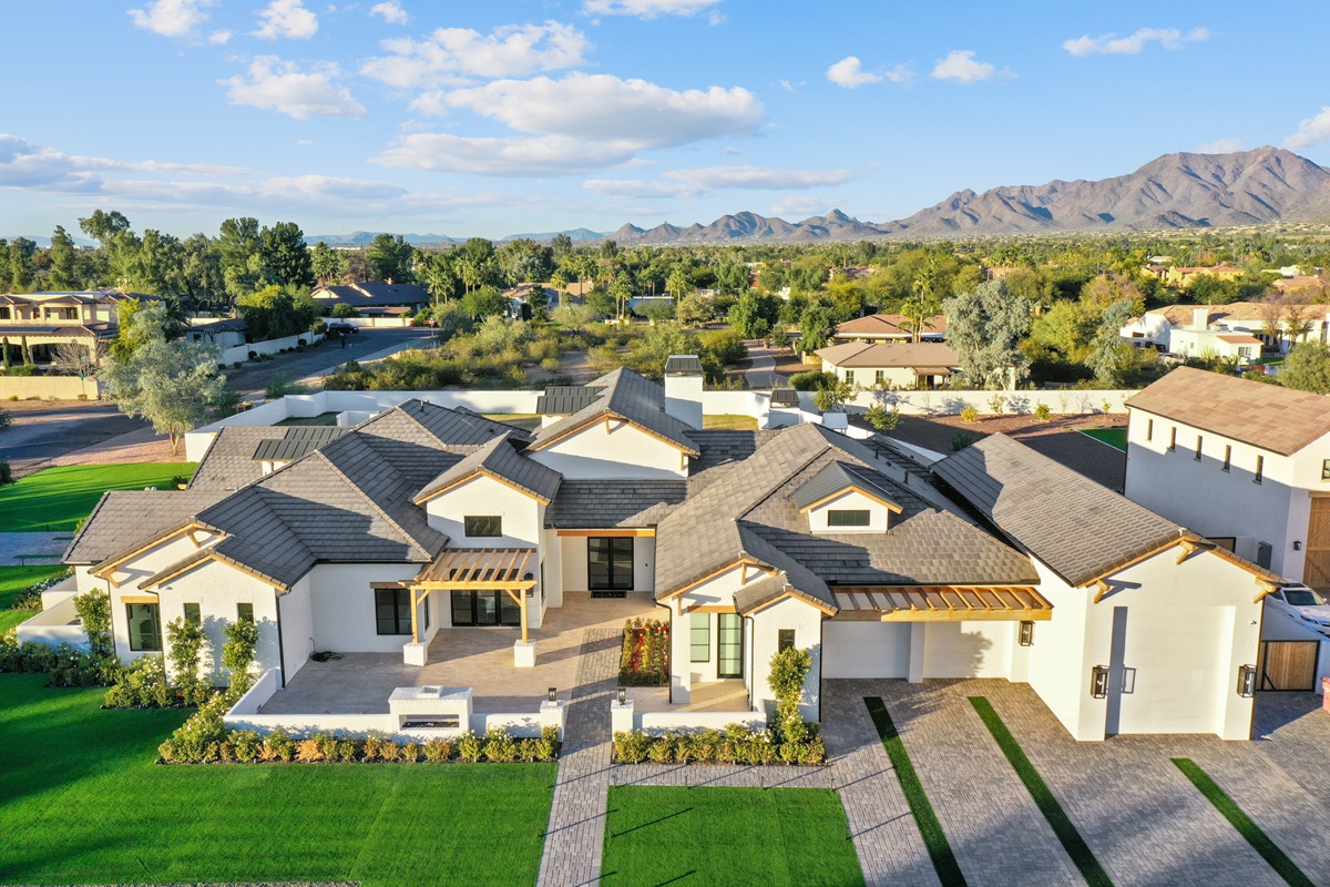 Aerial view of a luxury home in Scottsdale with mountains.