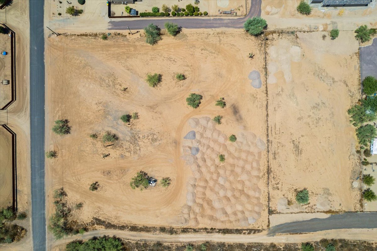 A top-down drone shot of a land parcel for sale.