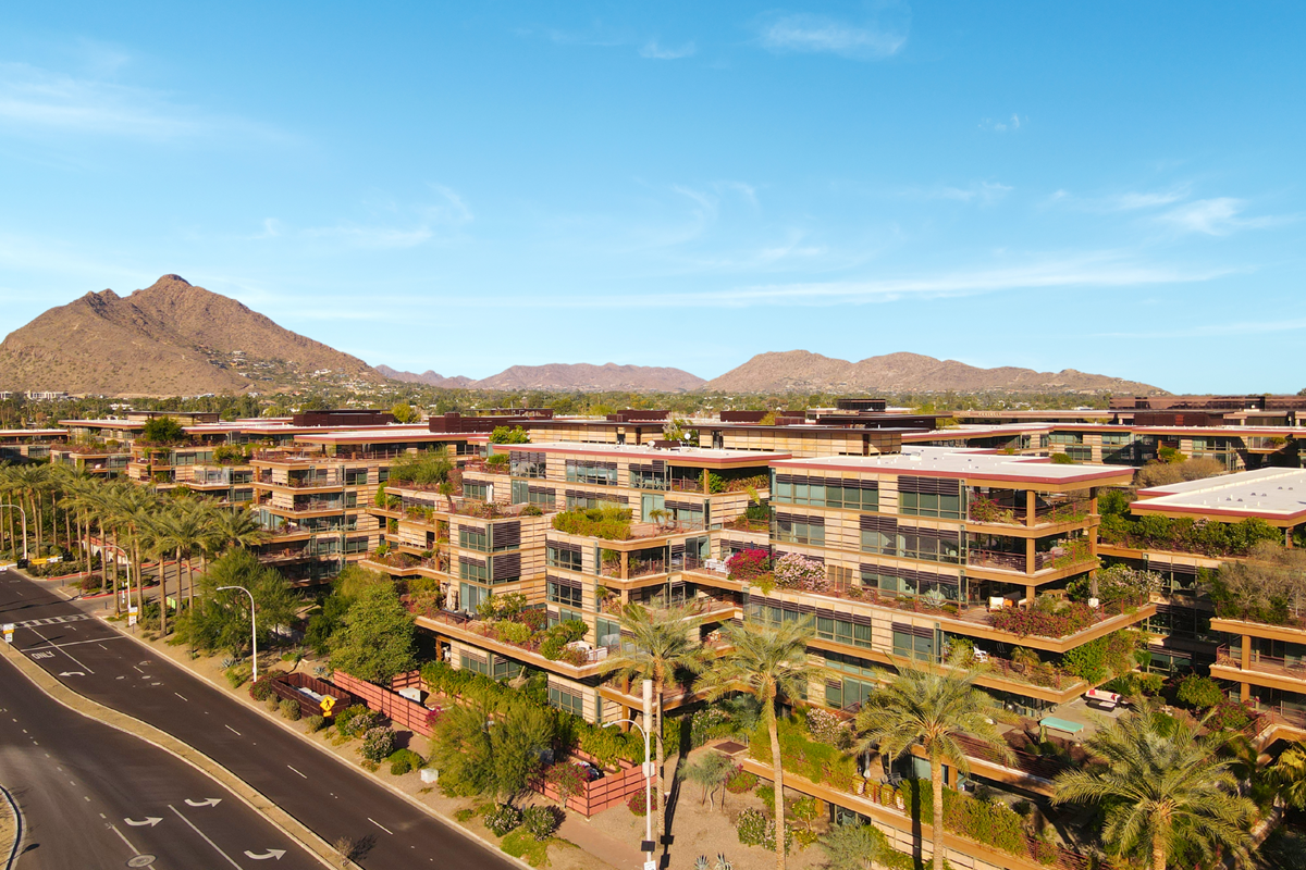 A drone photo of Optima Camelview Village in Old Town Scottsdale on a sunny day.