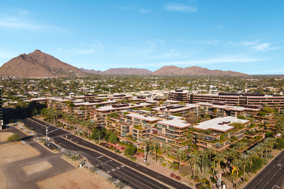 A drone photo of Optima Camelview Village in Old Town Scottsdale on a sunny day.