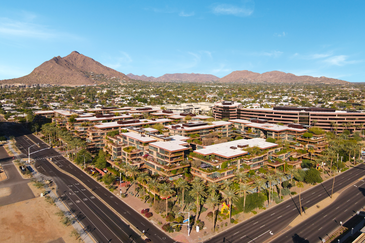 A drone photo of Optima Camelview Village in Old Town Scottsdale on a sunny day.