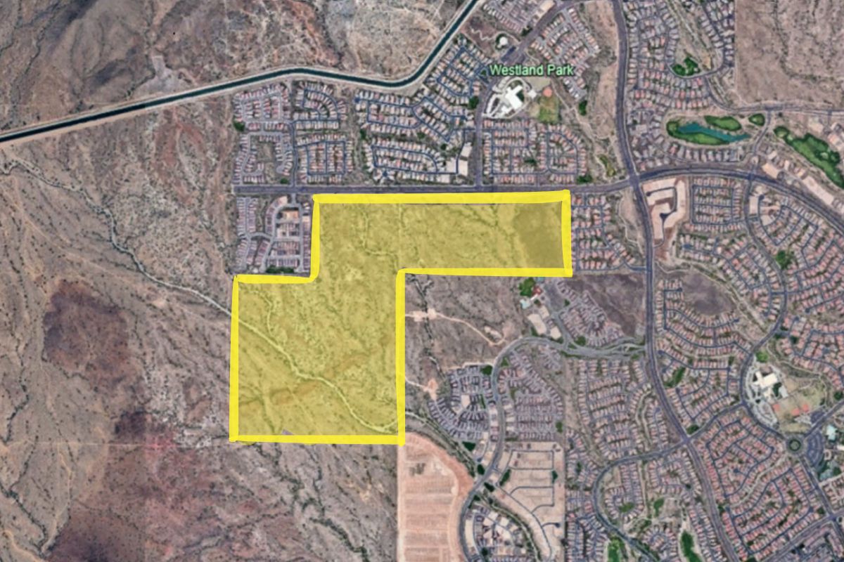 Map image showing a highlighted area of land in Peoria, Arizona. The highlighted portion is outlined in yellow and appears to encompass a section of desert terrain adjacent to established residential neighborhoods and Westland Park.