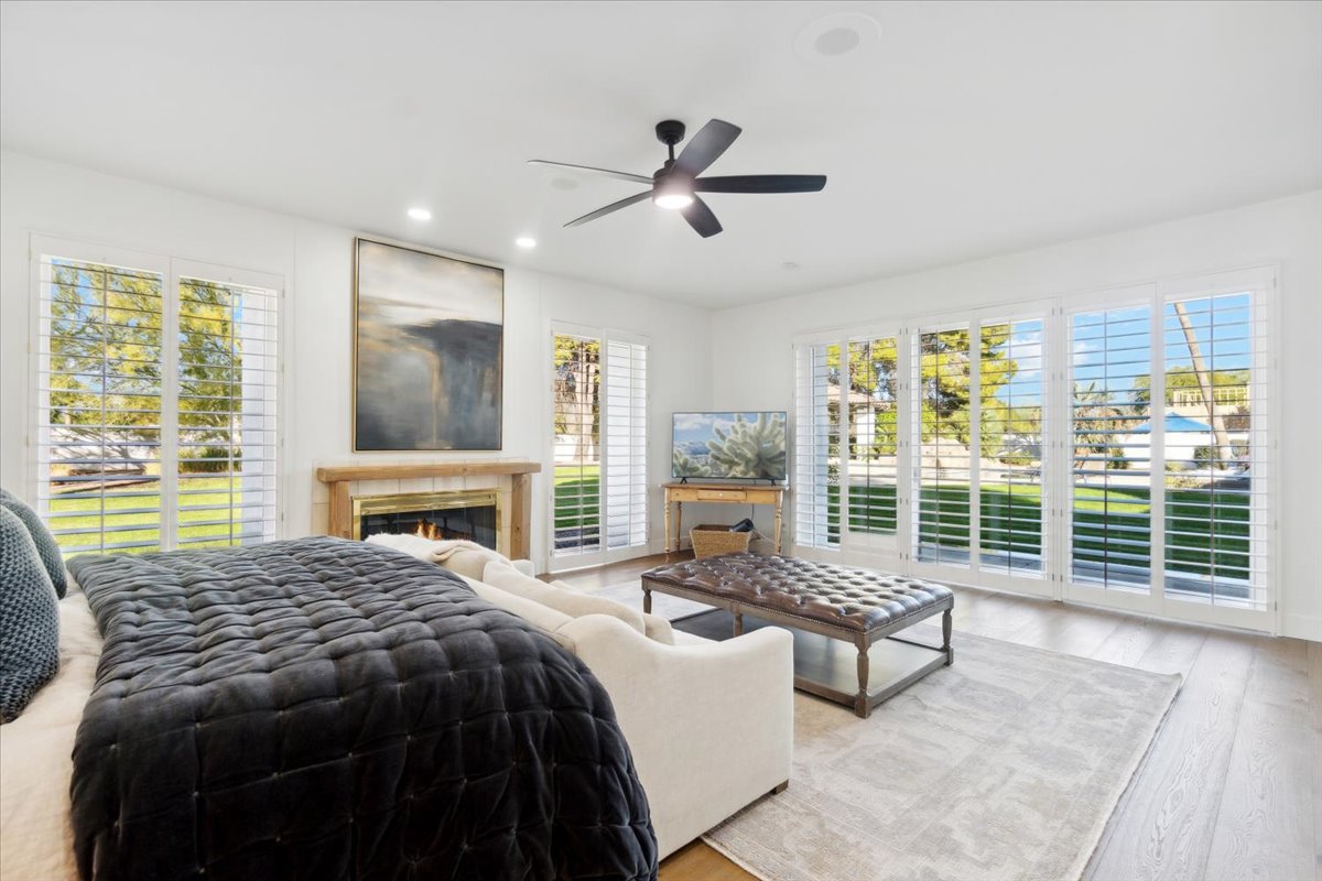 The primary bedroom of a high-end home.