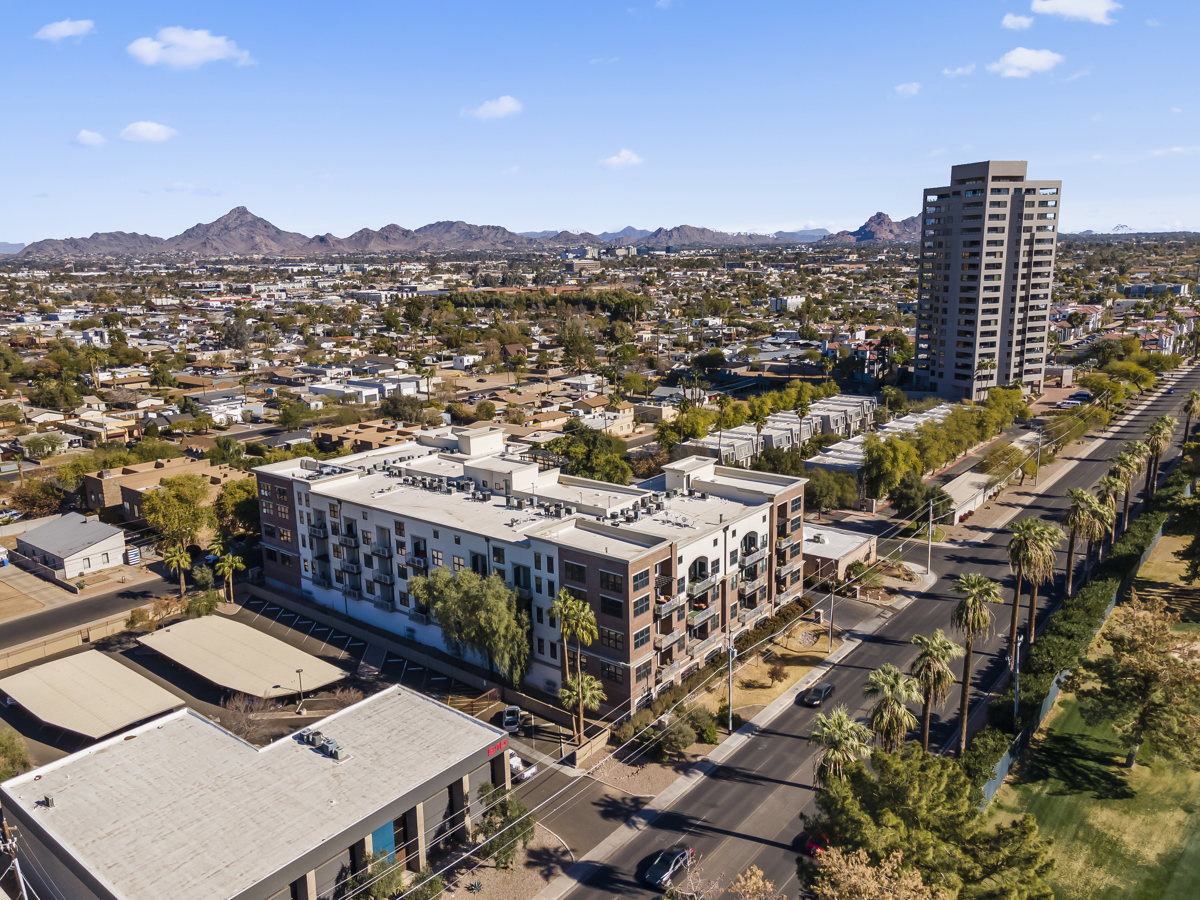 Aerial view of Midtown Phoenix with Camelback Mountain backdrop.
