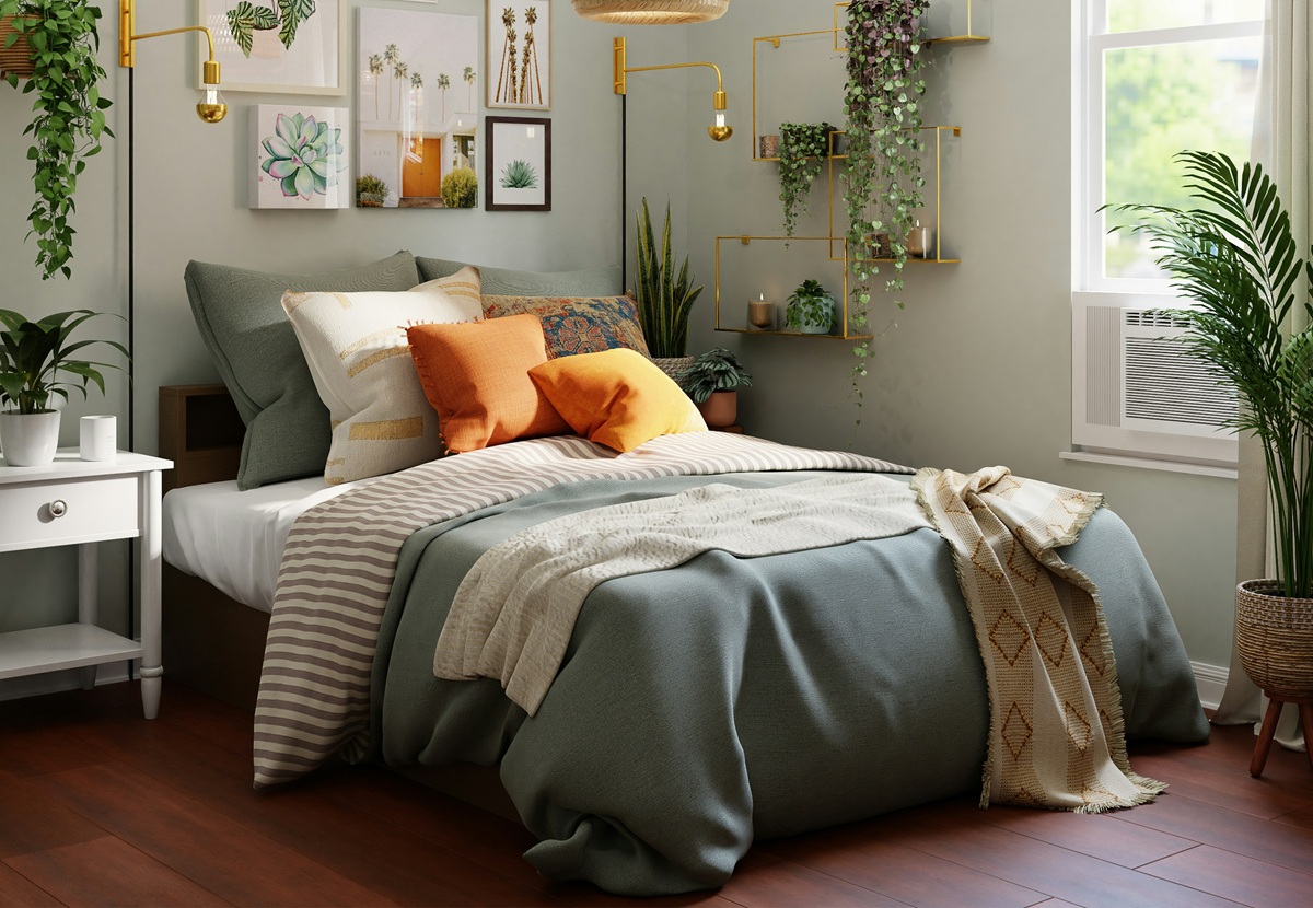 A cozy bedroom featuring a green bedspread, orange accent pillows, and lush greenery on shelves and walls, with warm natural lighting.