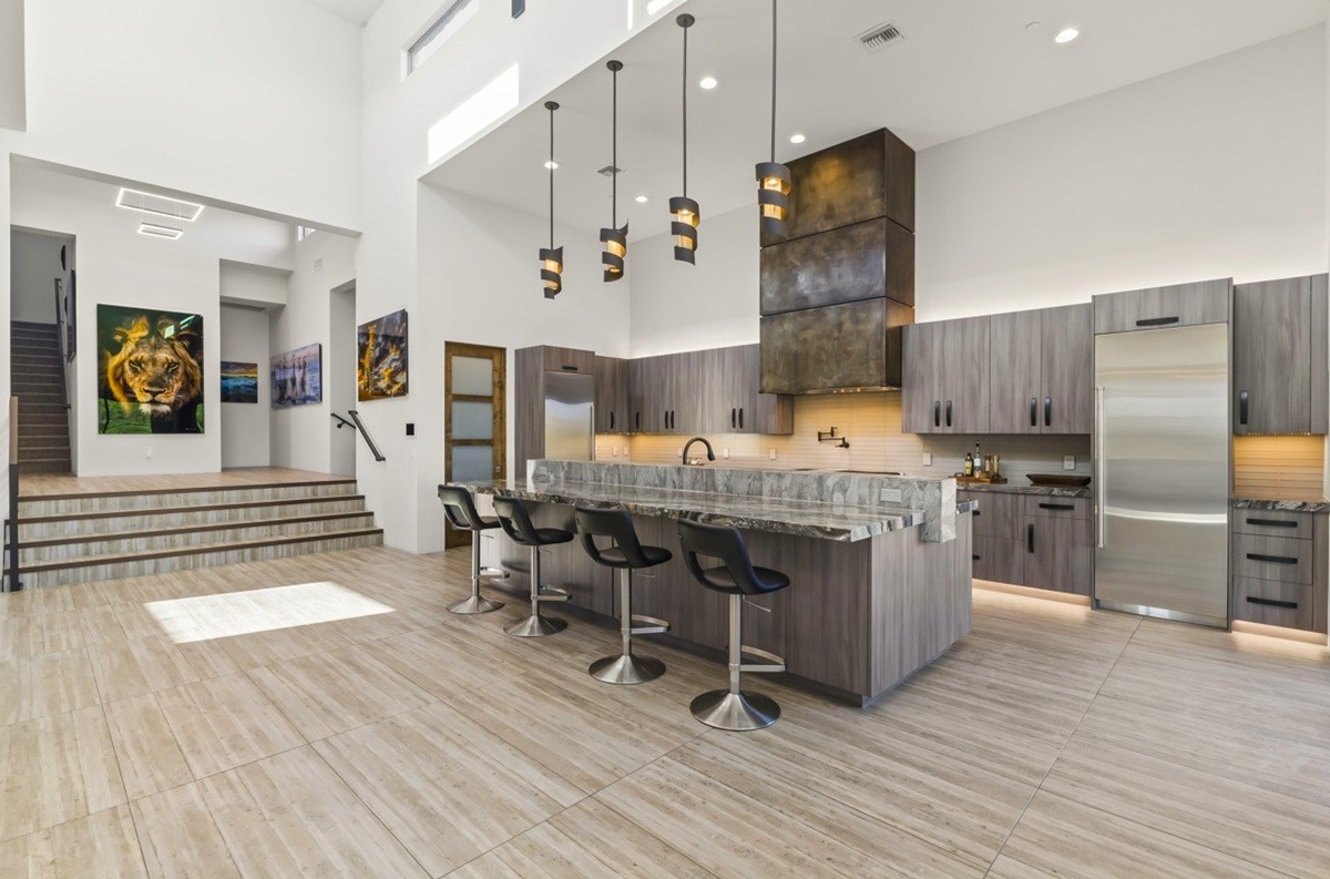 Modern kitchen with sleek design, high ceilings, and luxurious finishes.