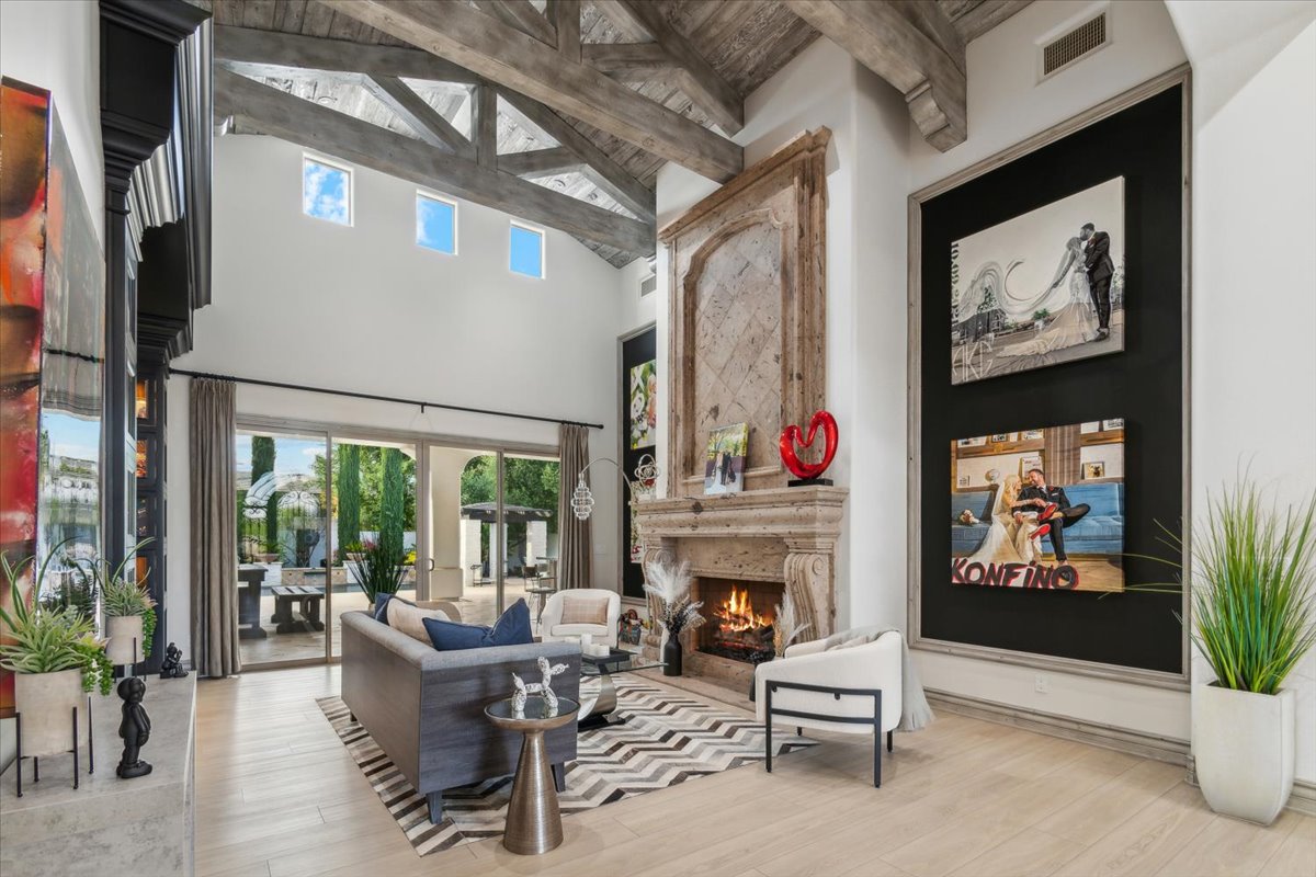 A luxury home's interior great room featuring a soaring ceiling.