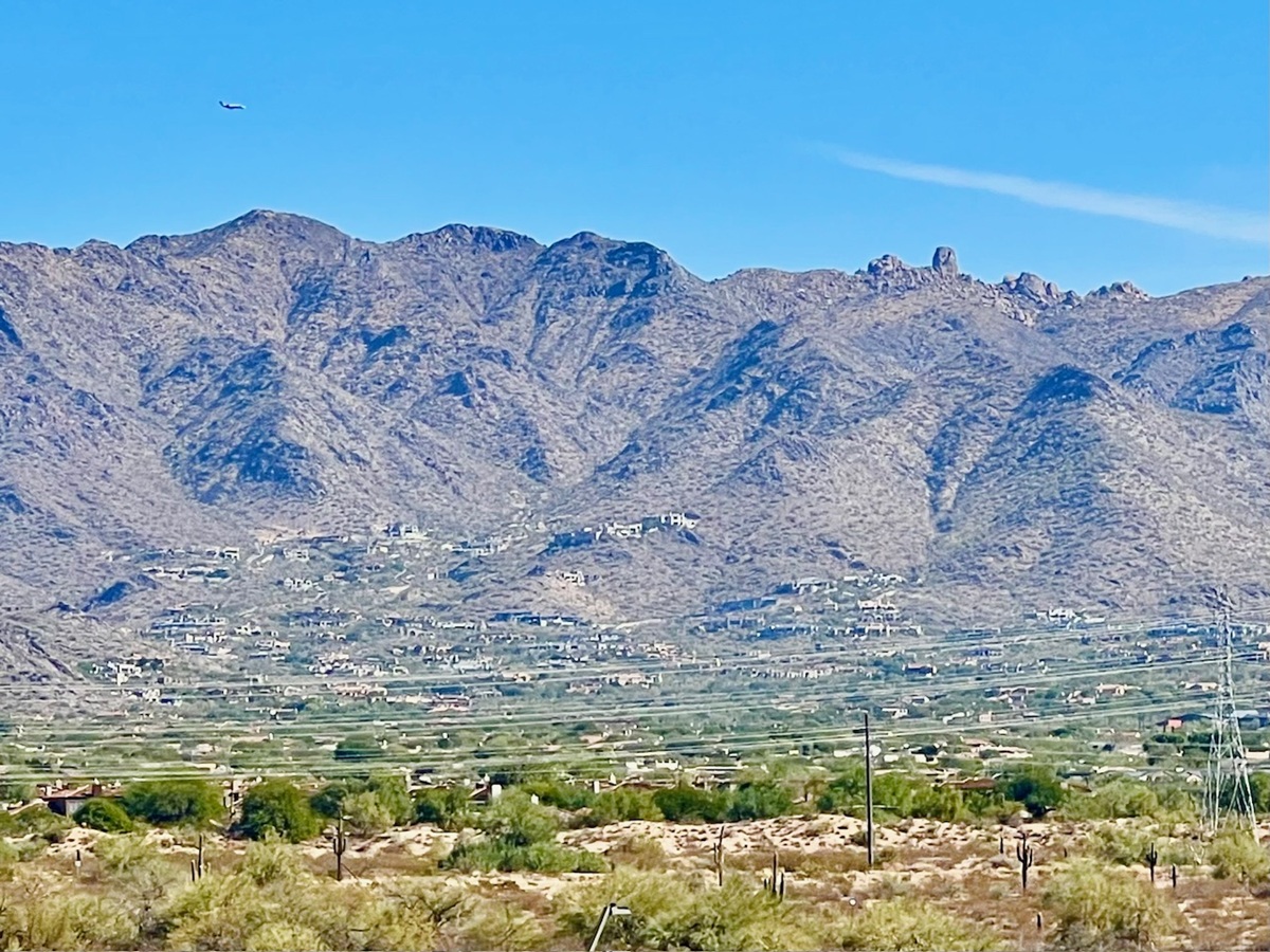Close-up of the McDowell Mountains with homes scattered along the foothills.
