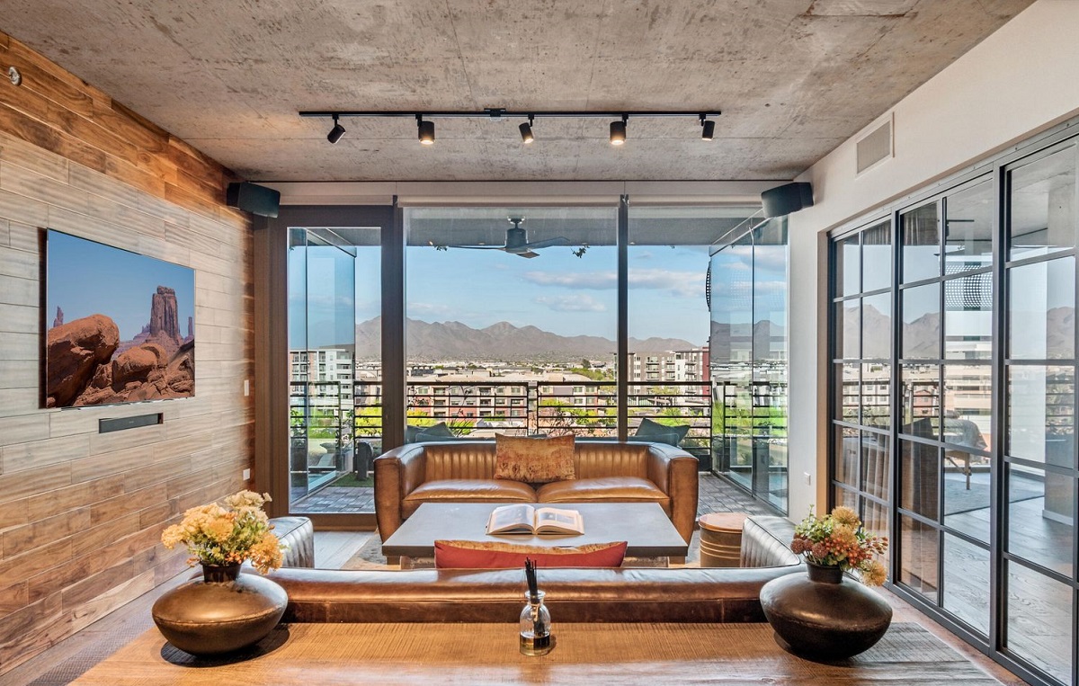 A luxury condo in Optima Kierland with a balcony looking out to the McDowell Mountains.