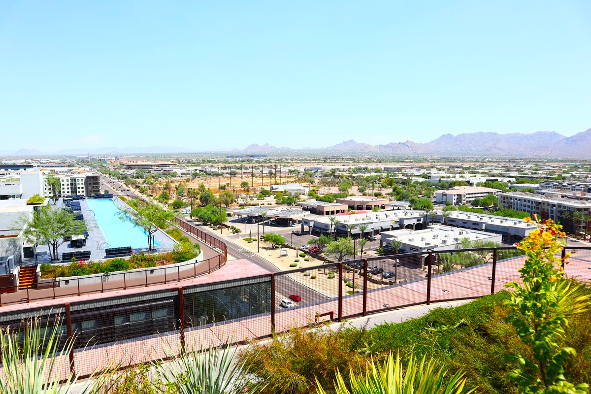 Rooftop pool view overlooking South Scottsdale and distant desert mountains.