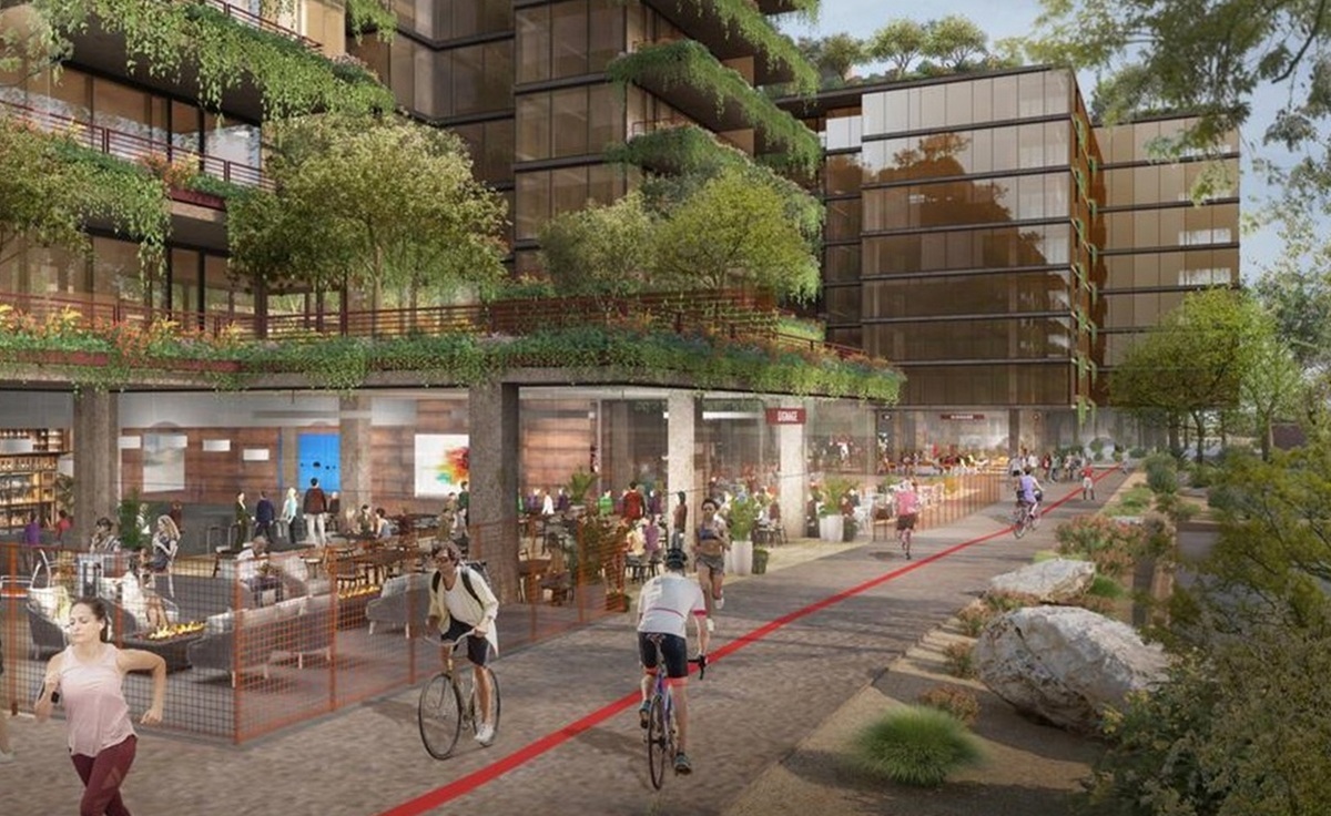 Rendering of Optima McDowell Mountain showing a vibrant mixed-use development with modern glass buildings adorned with lush greenery on balconies and rooftops. The street level features active retail and dining spaces with people walking, biking, and socializing along a landscaped pedestrian and bike path.