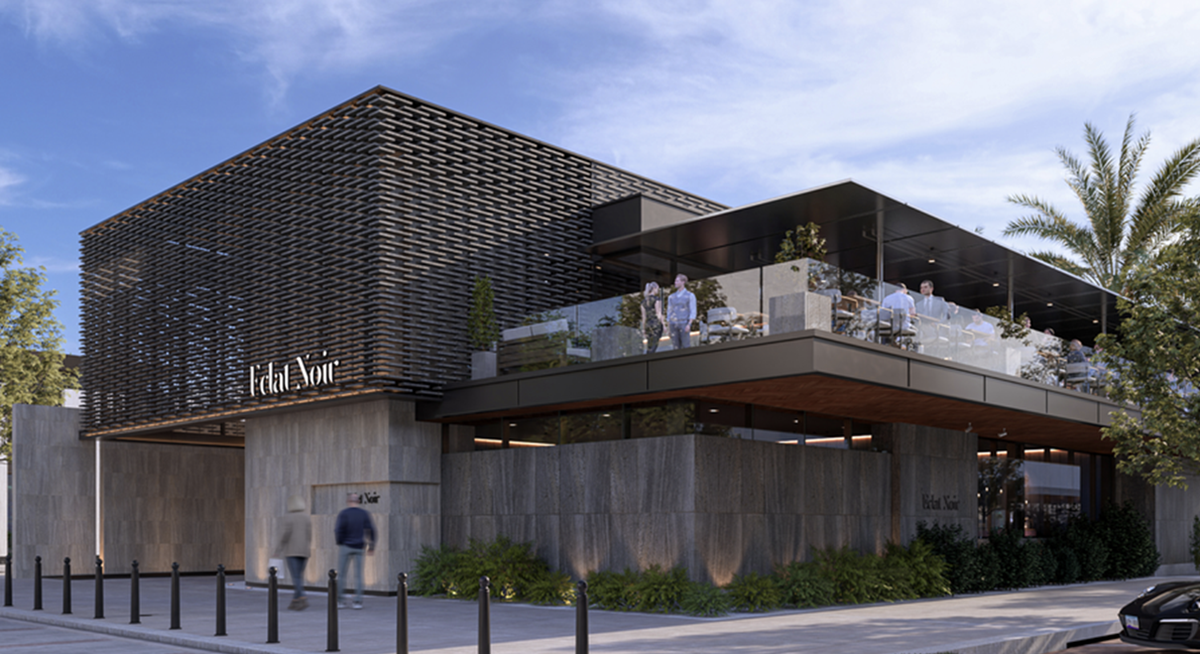 Modern restaurant at The Parque with metal façade and an upper outdoor dining deck.