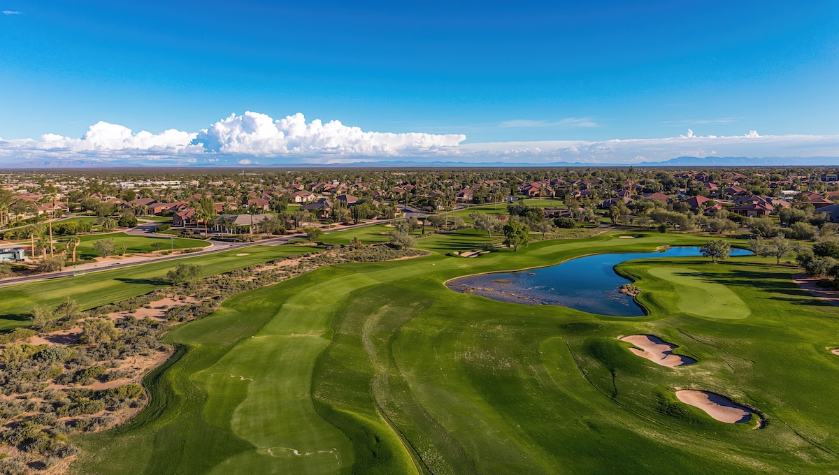Aerial perspective of a golf course, showcasing green landscapes and fairways, urban density