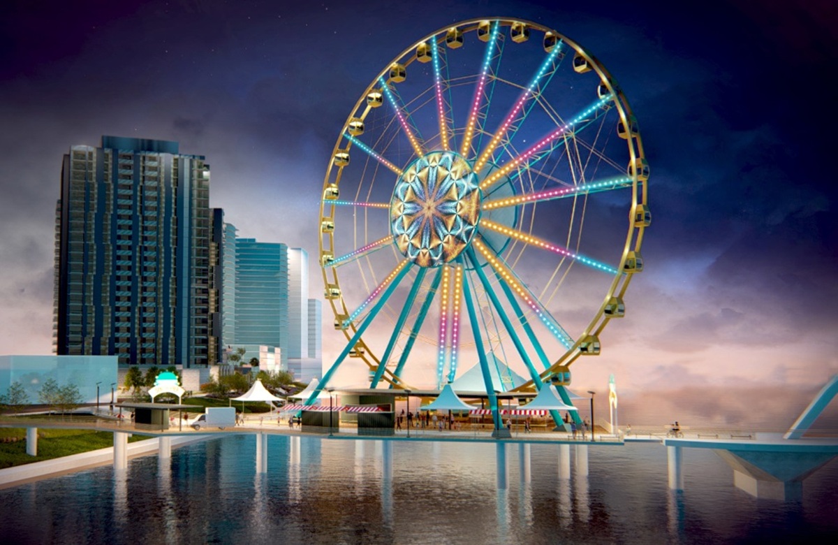 South Pier rendering with a lit Ferris wheel and waterfront towers at dusk.