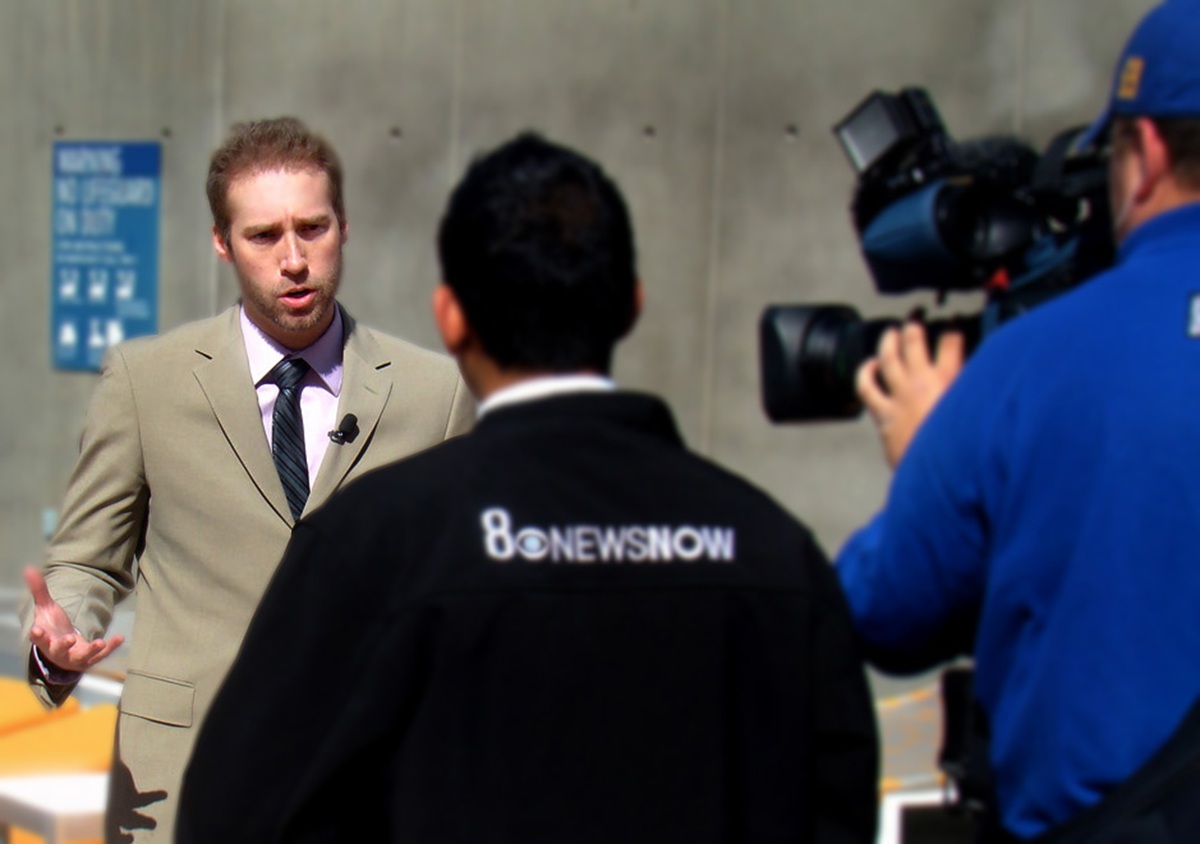 Aaron Auxier filming CBS News.