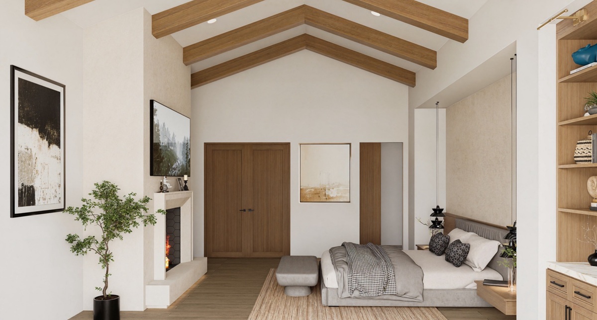 A luxury primary bedroom with vaulted ceilings, wood beams, and a modern fireplace.