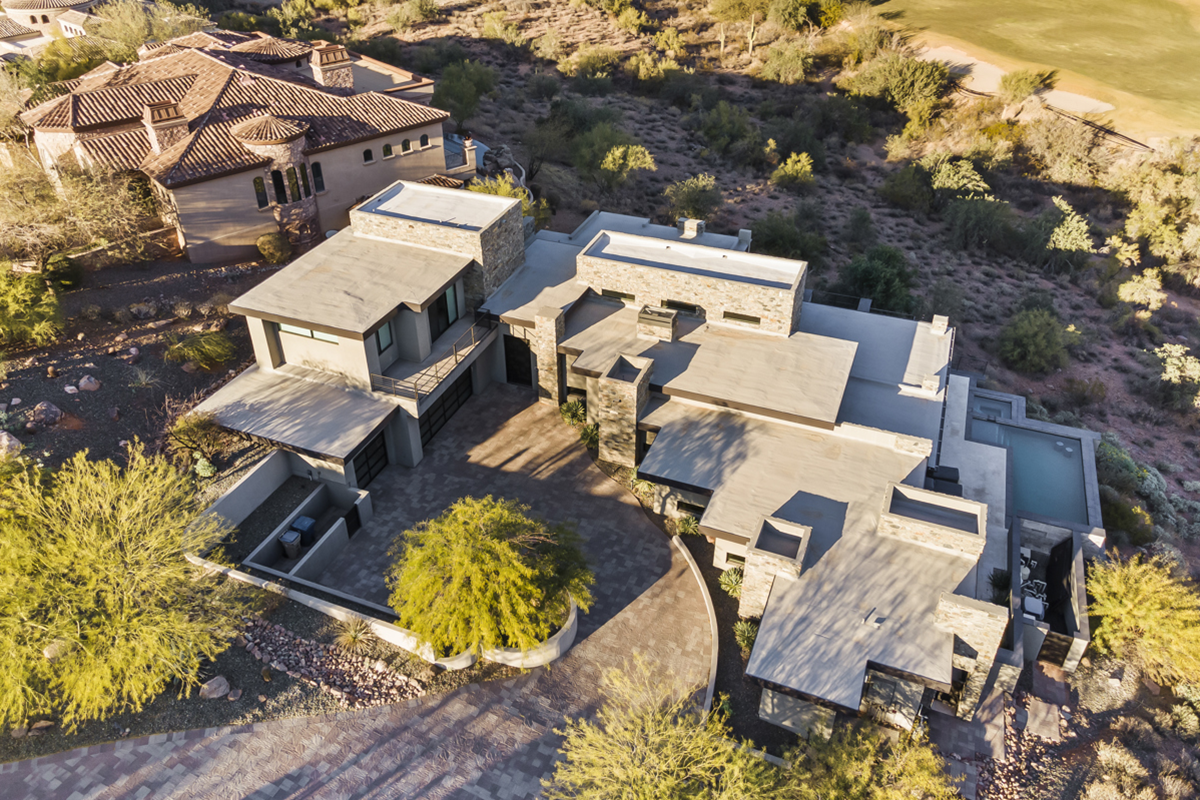 Aerial view of a modern luxury desert estate.
