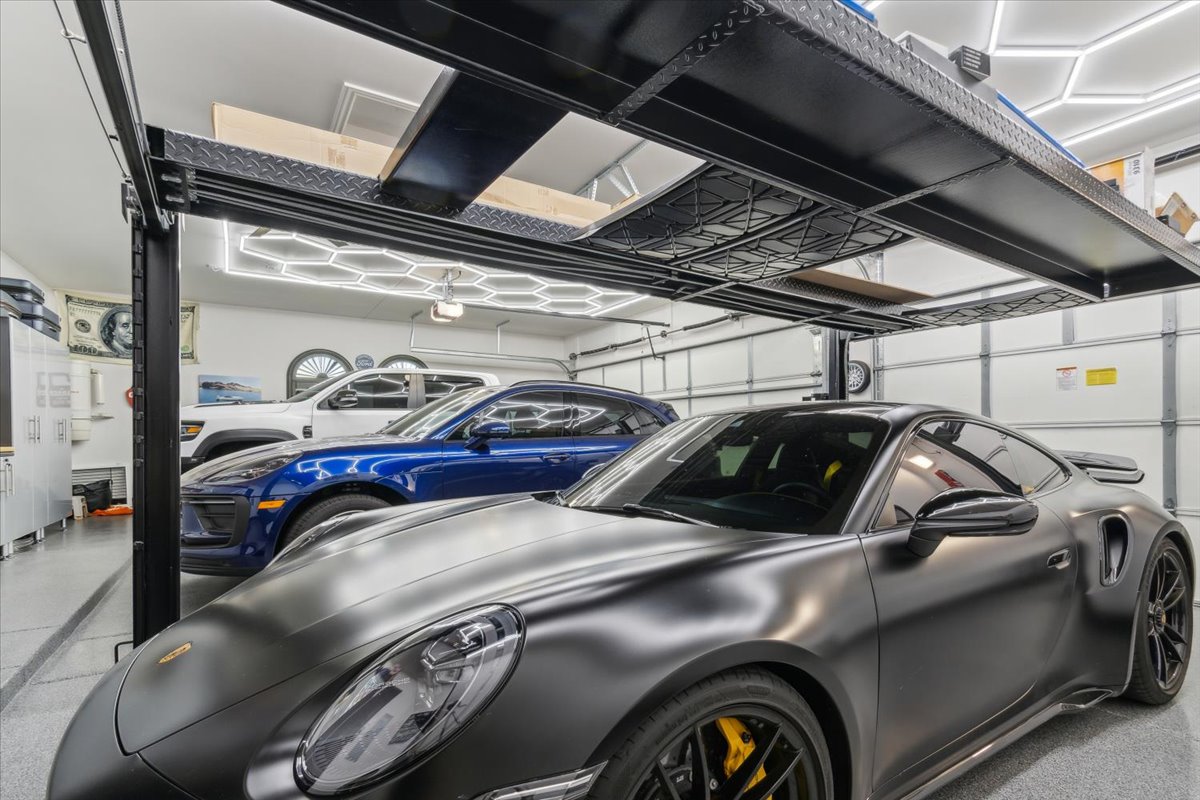 Luxury garage with high-end sports cars.