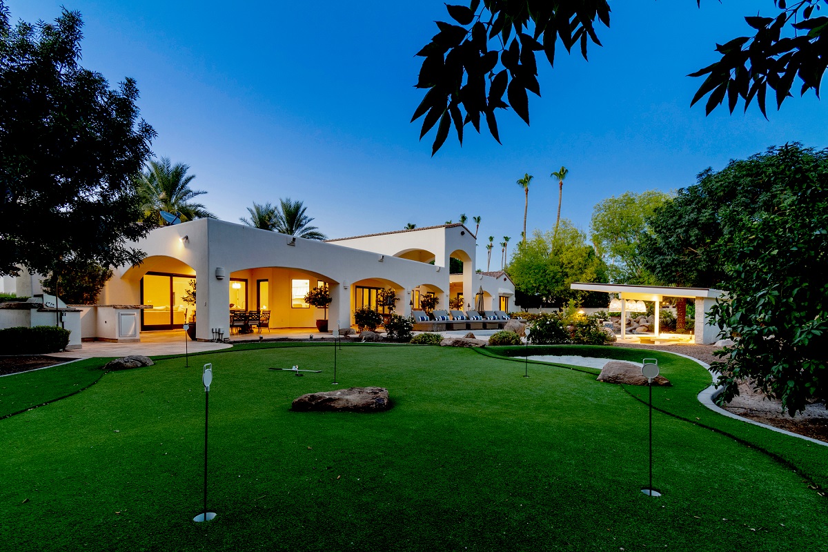 Scottsdale luxury backyard with a private putting green and desert landscaping.