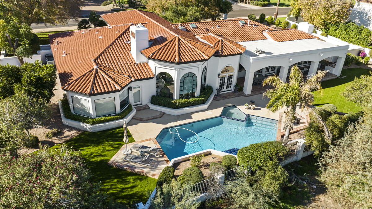 Aerial photo of a Paradise Valley estate with a swimming pool and lush landscaping.